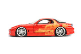 "Auto 1:24 FF - ORANGE JULIUS's Mazda RX-7 de Jada Toys con detalles que capturan su apariencia en la saga Fast & Furious."