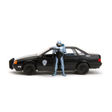 [PRE-VENTA] Auto 1:24 HWR 86 FORD TAURUS POLICE W/ROBOCOP   Jada toys  JT-33743 [PRECIO NORMAL S/.239]