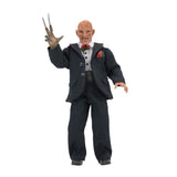 "Figura de Freddy Krueger de NECA con sus accesorios, incluyendo cabeza intercambiable y mano con guantes de cuchillas."
