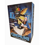 "Figura de acción Ultimate Gamer Gremlin de 7 pulgadas en su empaque original de NECA, mostrando el diseño detallado y la temática de gaming."
