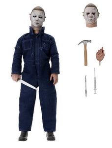 "Figura de acción Michael Myers con accesorios incluidos: cabeza intercambiable, cuchillo, martillo y jeringa."