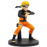 “Figura de Naruto en pose ninja con uniforme Shippuden.”
