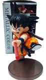 “Figura de Goku niño versión color especial con bastón extendido”