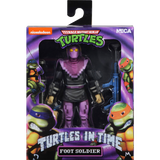"Figura TMNT Foot Soldier (54104) 54108 NECA en su empaque original, mostrando el diseño pixelado inspirado en el videojuego Turtles in Time."